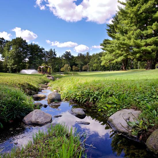View of Skidmore College landscape from a stream on campus
