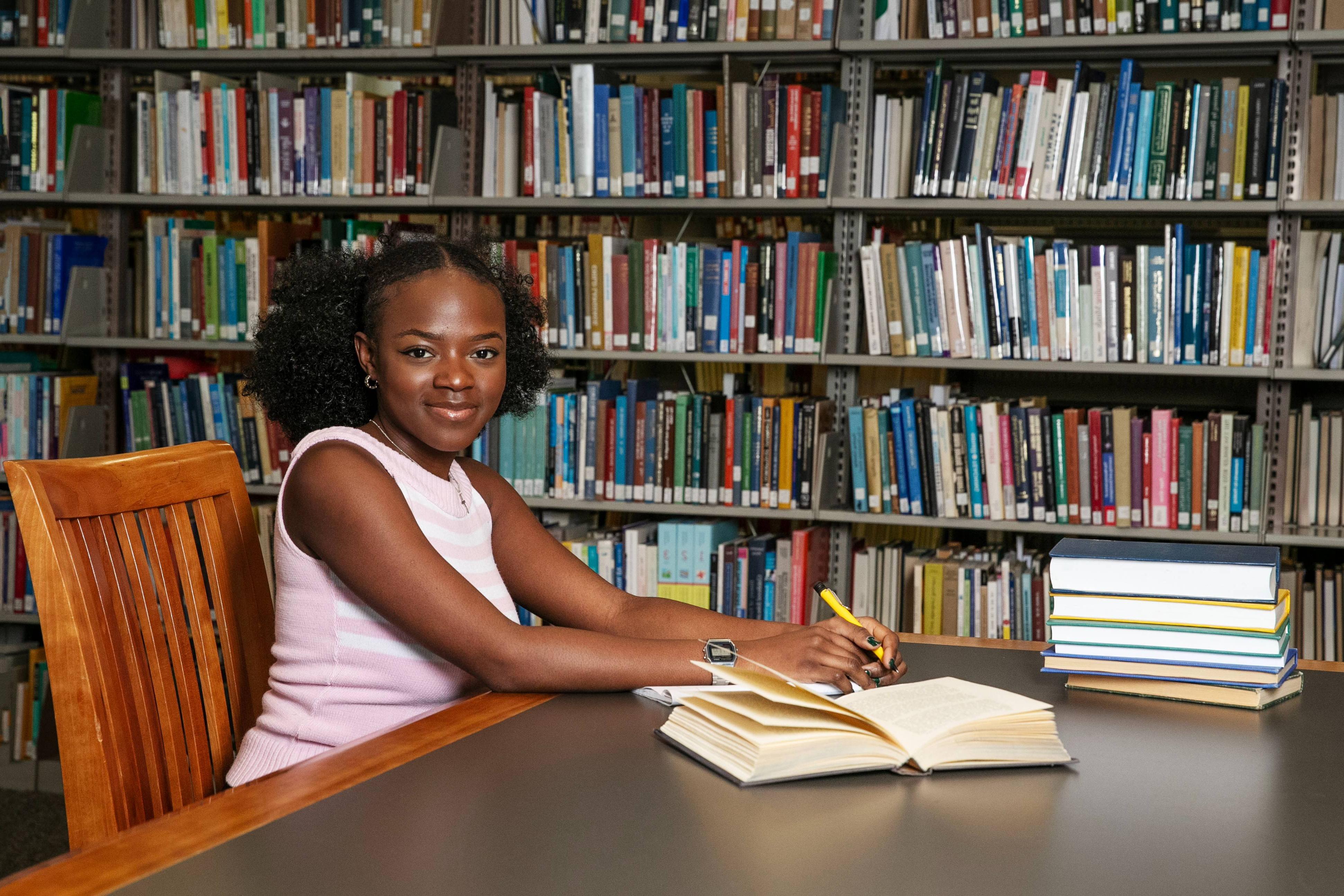 A photo of me, Anesu Mukombiwa ’24, in Skidmore’s Scribner Library, doing what I love: writing. 